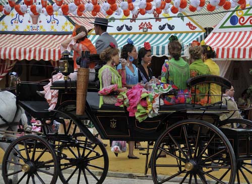 © Jennifer Singleton – Please do not copy or save without permission with the casetas and the traditional outfits, the feria is wonderfully colorful