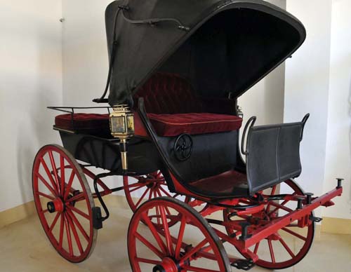 one of the family's carriages in the second storage area