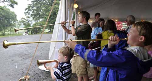© Jennifer Singleton – Please do not copy or save without permission on Saturday, the youth had fun with horn-blowing lessons from Rich O'Donnell