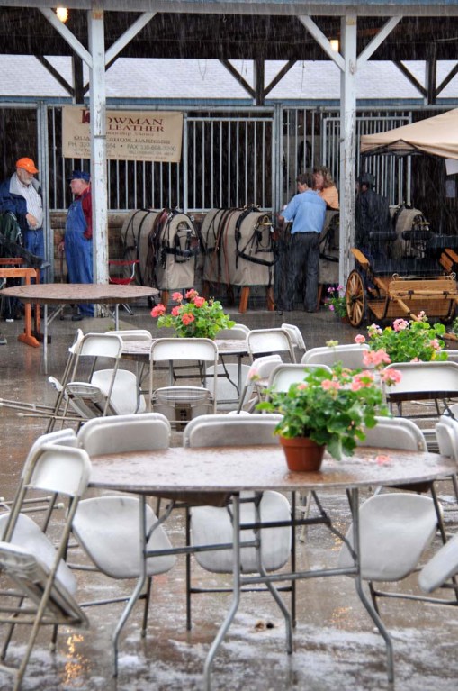 ... and then, sadly, this was the scene in the vendor area about ten minutes later (fortunately, everyone seems to have brought their wet-weather gear, even if they don't have it with them at all times)