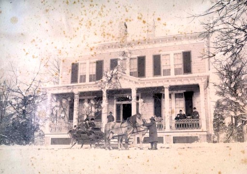 sleigh and pair in front of house